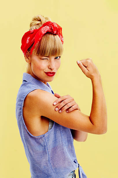 SanneBerg Plakát, Obraz - Beautiful woman flexing muscle, SanneBerg, 26.7 × 40 cm
