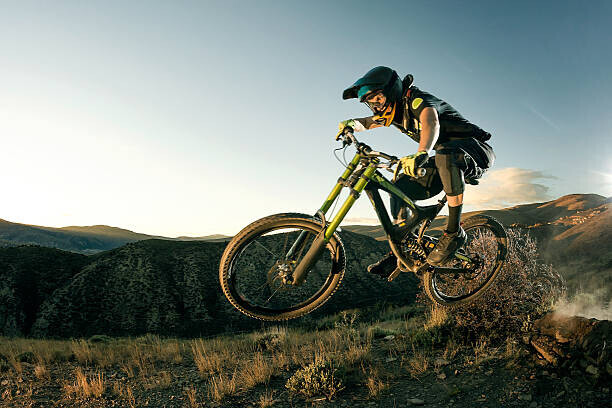 Daniel Milchev Plakát, Obraz - Female biker jumping on her mountain bike., Daniel Milchev, 40 × 26.7 cm