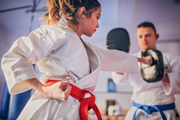 South_agency Plakát, Obraz - Female karate player practicing with trainer, South_agency, 40 × 26.7 cm