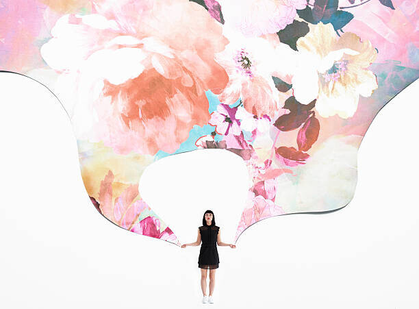 Tara Moore Plakát, Obraz - woman holding flowered wallpaper, Tara Moore, 40 × 30 cm