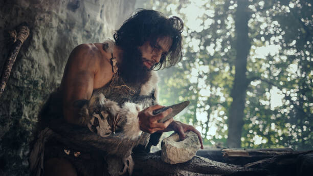 gorodenkoff Plakát, Obraz - Primeval Caveman Wearing Animal Skin Holds, gorodenkoff, 40 × 22.2 cm